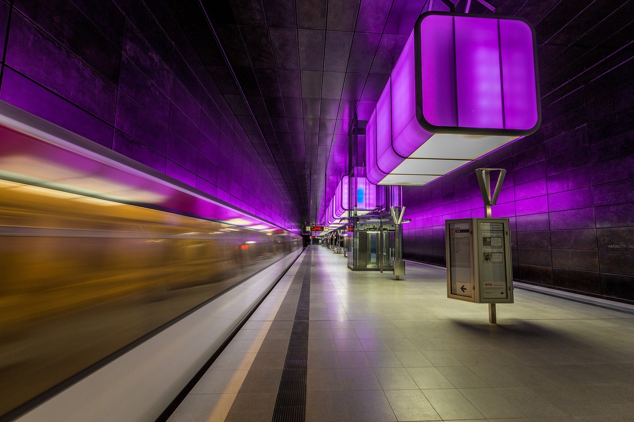 Image of a empty train station with purple lighting
